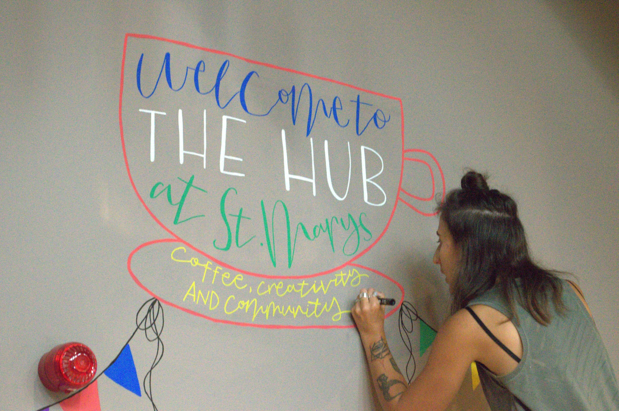 The Hub Lichfield community arts venue interior showing transformed church space with bar, theatre, and cultural gathering areas